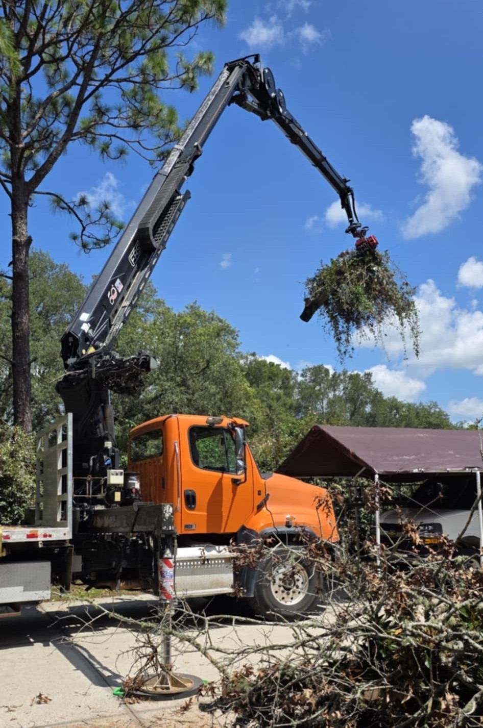 grappler claw cleans up storm debris
