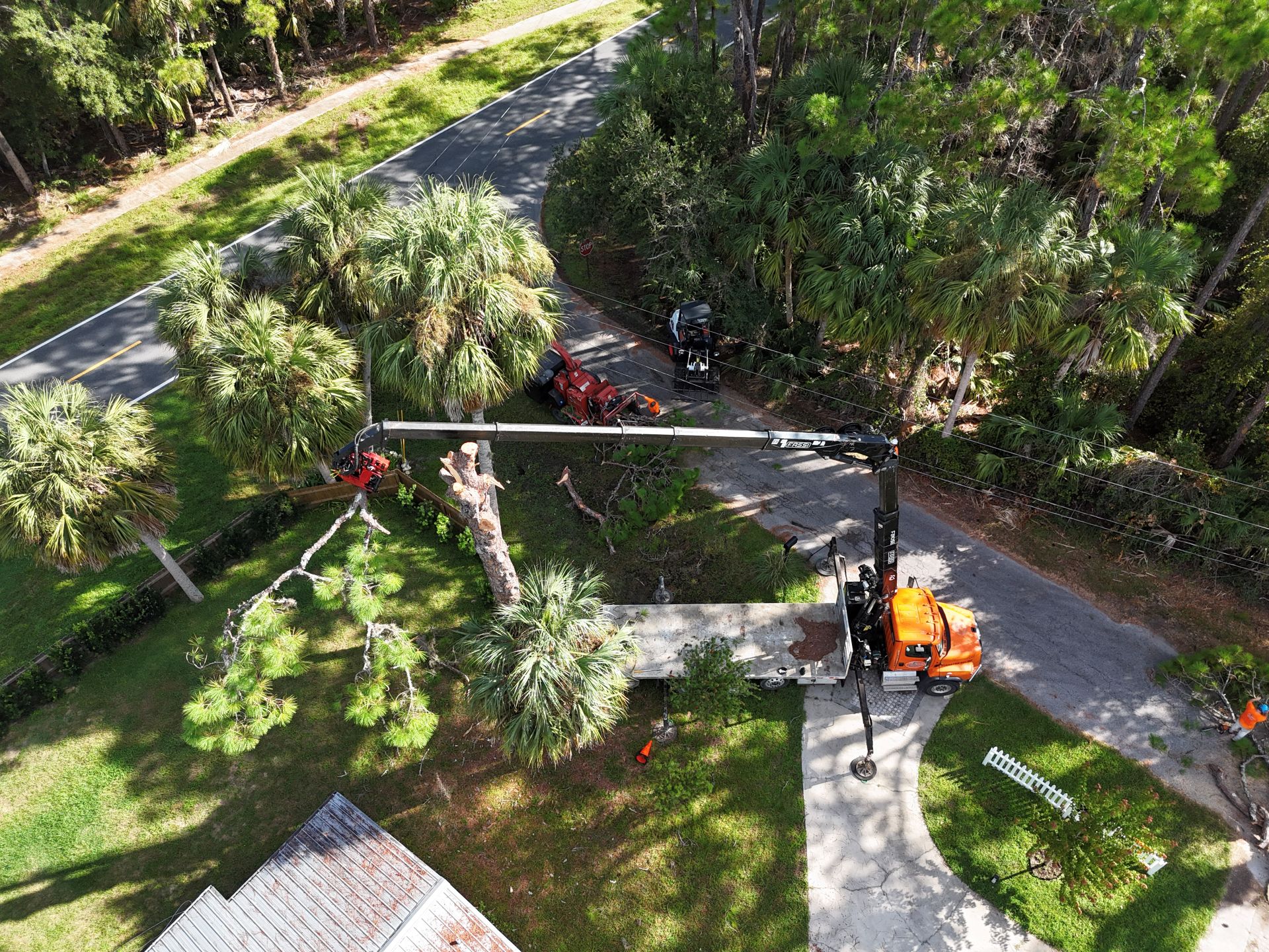 dustin and his crew are removing limbs from over a home after a complimentary tree inspection