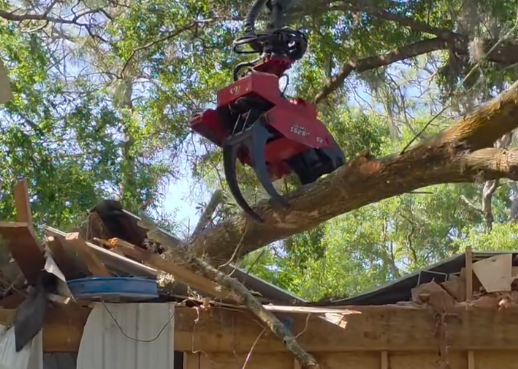 The graple claw removed a large limb that fell on the roof of the metal shop