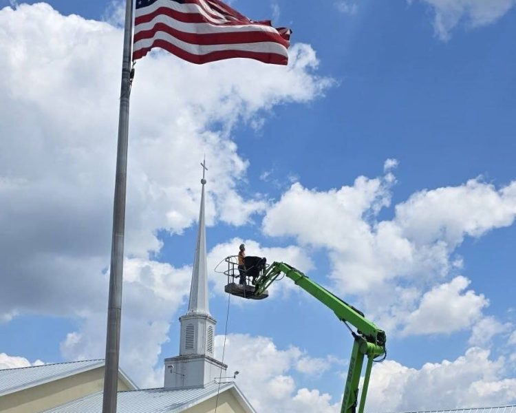 Lift truck used to pressure wash first united methodist church - boom lift services in dunnellon