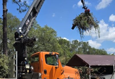 grappler claw cleans up storm debris